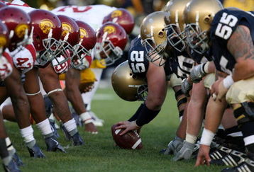 SOUTH BEND, IN - OCTOBER 17:  Braxston Cave #52 of the Notre Dame Fighting Irish prepares to snap the ball against the USC Trojans during the second quarter at Notre Dame Stadium on October 17, 2009 in South Bend, Indiana. (Photo by Jonathan Daniel/Getty Images)