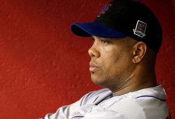 PHOENIX - AUGUST 11:  Starting pitcher Livan Hernandez #61 of the New York Mets reacts in the dugout after being removed from the major league baseball game against the Arizona Diamondbacks at Chase Field on August 11, 2009 in Phoenix, Arizona.  (Photo by Christian Petersen/Getty Images)