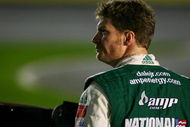 CONCORD, NC - OCTOBER 15: Dale Earnhardt Jr., driver of the #88 AMP Energy Chevrolet, stands on pit road during qualifying for the NASCAR Sprint Cup Series NASCAR Banking 500 at Lowe's Motor Speedway on October 15, 2009 in Concord, North Carolina. (Photo by Jason Smith/Getty Images for NASCAR)