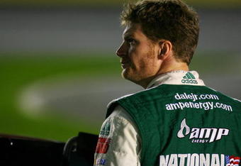 CONCORD, NC - OCTOBER 15:  Dale Earnhardt Jr., driver of the #88 AMP Energy Chevrolet, stands on pit road during qualifying for the NASCAR Sprint Cup Series NASCAR Banking 500 at Lowe's Motor Speedway on October 15, 2009 in Concord, North Carolina.  (Photo by Jason Smith/Getty Images for NASCAR)