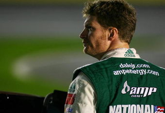 CONCORD, NC - OCTOBER 15:  Dale Earnhardt Jr., driver of the #88 AMP Energy Chevrolet, stands on pit road during qualifying for the NASCAR Sprint Cup Series NASCAR Banking 500 at Lowe's Motor Speedway on October 15, 2009 in Concord, North Carolina.  (Photo by Jason Smith/Getty Images for NASCAR)