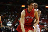MIAMI - NOVEMBER 19:  Andrea Bargnani #7 of the Toronto Raptors drives past Daequan Cook #14 of the Miami Heat at American Airlines Arena on November 19, 2008 in Miami, Florida. The Raptors defeated the Heat 101-95. NOTE TO USER: User expressly acknowledges and agrees that, by downloading and/or using this Photograph, user is consenting to the terms and conditions of the Getty Images License Agreement.  (Photo by Doug Benc/Getty Images)