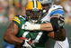 GREEN BAY, WI - OCTOBER 18: Cullen Jenkins #77 of the Green Bay Packers tries to run after intercepting a pass as Jeff Backus #76 of Detroit Lions drags him down at Lambeau Field on October 18, 2009 in Green Bay, Wisconsin. (Photo by Jonathan Daniel/Getty Images)