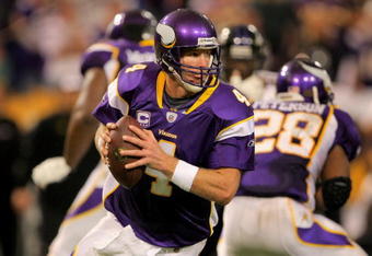 MINNEAPOLIS - OCTOBER 18:  Quarterback Brett Favre #4 of the Minnesota Vikings rolls out to deliver a pass against the Baltimore Ravens during NFL action at Hubert H. Humphrey Metrodome on October 18, 2009 in Minneapolis, Minnesota. Te Vikings defeated the Ravens 33-31.  (Photo by Doug Pensinger/Getty Images)