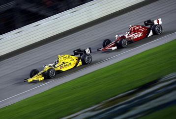 JOLIET, IL- AUGUST 29:  Dario Franchitti, driver of the #10 Lifelock Target Chip Ganassi Dallara Honda, drives in front of teammate Scott Dixon, driver of the #9 Target Chip Ganassi Dallara Honda, during the IRL IndyCar Series PEAK Antifreeze & Motor Oil Indy 300 on August 29, 2009 at the Chicagoland Speedway in Joliet, Illinois.  (Photo By Donald Miralle/Getty Images)