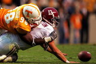 KNOXVILLE, TN - OCTOBER 23:  Qaurterback Spencer Pennington #13 of the Alabama Crimson Tide is sacked by Parys Haralson #98 of the Tennessee Volunteers during the second half of the game at Neyland Stadium on October 23, 2004 in Knoxville, Tennessee. (Photo by Jamie Squire/Getty Images)