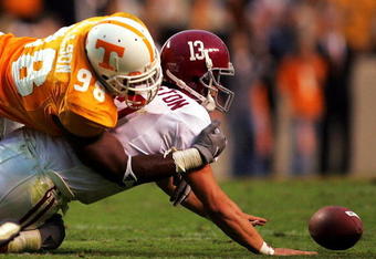 KNOXVILLE, TN - OCTOBER 23:  Qaurterback Spencer Pennington #13 of the Alabama Crimson Tide is sacked by Parys Haralson #98 of the Tennessee Volunteers during the second half of the game at Neyland Stadium on October 23, 2004 in Knoxville, Tennessee. (Photo by Jamie Squire/Getty Images)