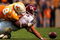 KNOXVILLE, TN - OCTOBER 23:  Qaurterback Spencer Pennington #13 of the Alabama Crimson Tide is sacked by Parys Haralson #98 of the Tennessee Volunteers during the second half of the game at Neyland Stadium on October 23, 2004 in Knoxville, Tennessee. (Photo by Jamie Squire/Getty Images)