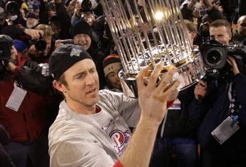 PHILADELPHIA - OCTOBER 29:  Chase Utley #26 of the Philadelphia Phillies celebrates with the World Series trophy after their 4-3 win against the Tampa Bay Rays during the continuation of game five of the 2008 MLB World Series on October 29, 2008 at Citizens Bank Park in Philadelphia, Pennsylvania.  (Photo by Doug Pensinger/Getty Images)