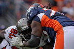 DENVER - OCTOBER 05:  Offensive tackle Ryan Clady #78 of the Denver Broncos blocks the rush of Gaines Adams #90 of the Tampa Bay Buccaneers during NFL action on October 5, 2008 in Denver, Colorado. The Broncos defeated the Buccaneers 16-13.  (Photo by Doug Pensinger/Getty Images)
