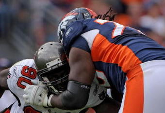 DENVER - OCTOBER 05:  Offensive tackle Ryan Clady #78 of the Denver Broncos blocks the rush of Gaines Adams #90 of the Tampa Bay Buccaneers during NFL action on October 5, 2008 in Denver, Colorado. The Broncos defeated the Buccaneers 16-13.  (Photo by Doug Pensinger/Getty Images)