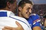 GAINESVILLE, FL - OCTOBER 17: Quarterback Tim Tebow #15 of the Florida Gators celebrates a win with coach Urban Meyer against the University of Arkansas Razorbacks October 17, 2009 at Ben Hill Griffin Stadium in Gainesville, Florida.  (Photo by Al Messerschmidt/Getty Images)