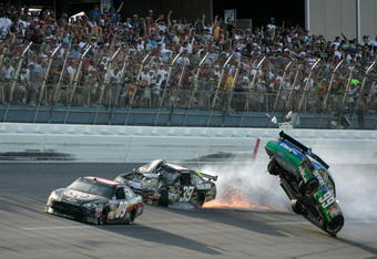 TALLADEGA, AL - APRIL 26:  Carl Edwards, driver of the #99 Claritin Ford, goes airborne as Ryan Newman, driver of the #39 Steweart-Haas Racing Chevrolet suffers damage and Brad Keselowski, driver of the #09 Miccosukee Indian Gaming Chevrolet drives at the conclusion of the NASCAR Sprint Cup Series Aaron's 499 at Talladega Superspeedway on April 26, 2009 in Talladega, Alabama.  (Photo by Jerry Markland/Getty Images for NASCAR)