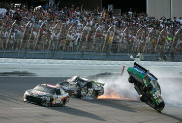 TALLADEGA, AL - APRIL 26:  Carl Edwards, driver of the #99 Claritin Ford, goes airborne as Ryan Newman, driver of the #39 Steweart-Haas Racing Chevrolet suffers damage and Brad Keselowski, driver of the #09 Miccosukee Indian Gaming Chevrolet drives at the conclusion of the NASCAR Sprint Cup Series Aaron's 499 at Talladega Superspeedway on April 26, 2009 in Talladega, Alabama.  (Photo by Jerry Markland/Getty Images for NASCAR)