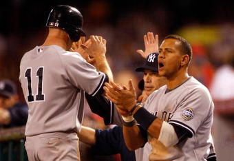 ANAHEIM, CA - OCTOBER 20:  Alex Rodriguez #13 (R) of the New York Yankees cheers on his teammates during the ninth inning in Game Four of the ALCS against the Los Angeles Angels of Anaheim during the 2009 MLB Playoffs at Angel Stadium on October 20, 2009 in Anaheim, California.  (Photo by Jeff Gross/Getty Images)