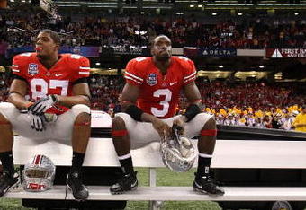 NEW ORLEANS - JANUARY 07:  Brandon Smith #87 and Brandon Saine #3 of the Ohio State Buckeyes sit dejected after losing 38-24 to the Louisiana State University Tigers during the AllState BCS National Championship on January 7, 2008 at the Louisiana Superdome in New Orleans, Louisiana.  (Photo by Andy Lyons/Getty Images)