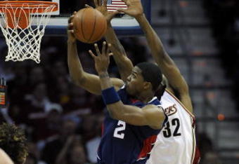 CLEVELAND - MAY 07: Joe Johnson #2 of the Atlanta Hawks passe tries to get a shot off past Joe Smith #32 of the Cleveland Cavaliers during Game Two of the Eastern Conference Semifinals during the 2009 NBA Playoffs at Quicken Loans Arena on May 7, 2009 in Cleveland, Ohio.  NOTE TO USER: User expressly acknowledges and agrees that, by downloading and or using this photograph, User is consenting to the terms and conditions of the Getty Images License Agreement.  (Photo by Gregory Shamus/Getty Images)