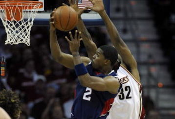 CLEVELAND - MAY 07: Joe Johnson #2 of the Atlanta Hawks passe tries to get a shot off past Joe Smith #32 of the Cleveland Cavaliers during Game Two of the Eastern Conference Semifinals during the 2009 NBA Playoffs at Quicken Loans Arena on May 7, 2009 in Cleveland, Ohio.  NOTE TO USER: User expressly acknowledges and agrees that, by downloading and or using this photograph, User is consenting to the terms and conditions of the Getty Images License Agreement.  (Photo by Gregory Shamus/Getty Images)