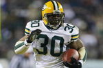 PHILADELPHIA - JANUARY 11:  Running back Ahman Green #30 of the Green Bay Packers carries the football for 33-yards against the Philadelphia Eagles in the second quarter during the NFC divisional playoffs on January 11, 2004 at Lincoln Financial Field in Philadelphia, Pennsylvania.  (Photo by Doug Pensinger/Getty Images)  
