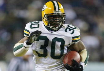 PHILADELPHIA - JANUARY 11:  Running back Ahman Green #30 of the Green Bay Packers carries the football for 33-yards against the Philadelphia Eagles in the second quarter during the NFC divisional playoffs on January 11, 2004 at Lincoln Financial Field in Philadelphia, Pennsylvania.  (Photo by Doug Pensinger/Getty Images)  