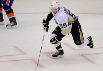 UNIONDALE, NY - OCTOBER 03:  Sergei Gonchar #55 of the Pittsburgh Penguins skates with the puck against the New York Islanders at an NHL hockey game at the Nassau Coliseum on October 3, 2009 in Uniondale, New York. The Penguins defeated the Islanders 4-3 in shootout overtime.  (Photo by Paul Bereswill/Getty Images)