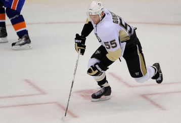 UNIONDALE, NY - OCTOBER 03:  Sergei Gonchar #55 of the Pittsburgh Penguins skates with the puck against the New York Islanders at an NHL hockey game at the Nassau Coliseum on October 3, 2009 in Uniondale, New York. The Penguins defeated the Islanders 4-3 in shootout overtime.  (Photo by Paul Bereswill/Getty Images)