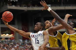 GLENDALE, AZ - MARCH 28: (L-R) Guard Kemba Walker #15 of the Connecticut Huskies goes up for a shot against forwards Leo Lyons #5 and DeMarre Carroll #1 of the Missouri Tigers in the Elite Eight of the NCAA Division I Men's Basketball Tournament at the University of Phoenix Stadium on March 28, 2009 in Glendale, Arizona. (Photo by Ronald Martinez/Getty Images)