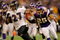 MINNEAPOLIS - OCTOBER 18:  Running back Ray Rice #27 of the Baltimore Ravens eludes Tyrell Johnson #25 of the Minnesota Vikings as he rushes 33 yards for a fourth quarter touchdown during NFL action at Hubert H. Humphrey Metrodome on October 18, 2009 in Minneapolis, Minnesota. The Vikings defeated the Ravens 33-31.  (Photo by Doug Pensinger/Getty Images)