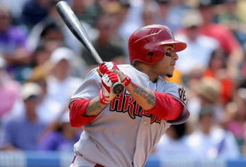 DENVER - JULY 05:  Felipe Lopez #2 of the Arizona Diamondbacks follows through on his game winning RBI single to centerfield off of starting pitcher Ubaldo Jimenez of the Colorado Rockies to score Gerardo Parra in the seventh inning during MLB action at Coors Field on July 5, 2009 in Denver, Colorado. The Diamondbacks defeated the Rockies 4-3.  (Photo by Doug Pensinger/Getty Images)