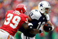 KANSAS CITY, MO - OCTOBER 11:  Miles Austin #19 of the Dallas Cowboys carries the ball as Brandon Carr #39 of the Kansas City Chiefs defends during the game on October 11, 2009 at Arrowhead Stadiumin Kansas City, Missouri.  (Photo by Jamie Squire/Getty Images)