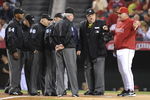 ANAHEIM, CA - OCTOBER 08:  Mike Scioscia #14 manager of the Los Angeles Angels of Anaheim speaks to the umpires at the start Game One of the ALDS against the Boston Red Sox during the 2009 MLB Playoffs at Angel Stadium on October 8, 2009 in Anaheim, California.  (Photo by Lisa Blumenfeld/Getty Images)