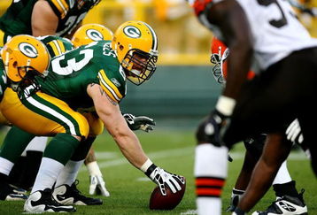 GREEN BAY, WI - AUGUST 15:  Center Scott Wells #63 of the Green Bay Packers prepares to snap the ball against the Cleveland Browns during the preseason game at Lambeau Field on August 15, 2009 in Green Bay, Wisconsin.  (Photo by Jonathan Daniel/Getty Images)