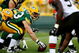 GREEN BAY, WI - AUGUST 15: Center Scott Wells #63 of the Green Bay Packers prepares to snap the ball against the Cleveland Browns during the preseason game at Lambeau Field on August 15, 2009 in Green Bay, Wisconsin. (Photo by Jonathan Daniel/Getty Images)