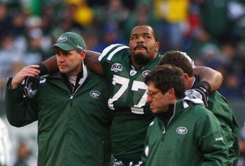 EAST RUTHERFORD, NJ - OCTOBER 18:  Kris Jenkins #77 of the New York Jets is helped off the field after being injured in the second quarter against the Buffalo Bills at Giants Stadium in the Meadowlands on October 18, 2009 in East Rutherford, New Jersey.  (Photo by Mike Stobe/Getty Images)