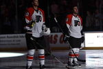 SUNRISE, FL - OCTOBER 16: Chris Pronger #20 and Mike Richards #18 of the Philadelphia Flyers stand during the playing of the national anthem prior to the game against the Florida Panthers on October 16, 2009 at the BankAtlantic Center in Sunrise, Florida. (Photo by Joel Auerbach/Getty Images)