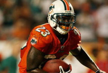 MIAMI - OCTOBER 12:  Running back Ronnie Brown #23 of the Miami Dolphins scores the game-winning touchdown against the New York Jets at Land Shark Stadium on October 12, 2009 in Miami, Florida. The Dolphins defeated the Jets 31-27.  (Photo by Doug Benc/Getty Images)