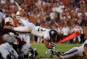 AUSTIN, TX - SEPTEMBER 20:  James Casey #12 of the Rice Owls dives during the game against the Texas Longhorns on September 20, 2008 at Darrell K Royal-Texas Memorial Stadium in Austin, Texas. Texas won 52-10. (Photo by Brian Bahr/Getty Images)