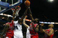 LONDON, ENGLAND - OCTOBER 06:  Chicago Bulls and  Utah Jazz players jump for the rebound during the NBA pre-season game as part of the 2009 NBA Europe Live Tour between Chicago Bulls and Utah Jazz at the O2 Arena on October 6, 2009 in London, England.  NOTE TO USER: User expressly acknowledges and agrees that, by downloading and/or using this Photograph, user is consenting to the terms and conditions of the Getty Images License Agreement.  (Photo by Clive Rose/Getty Images)