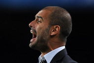 BARCELONA, SPAIN - OCTOBER 20:  Coach Josep Guardiola of FC Barcelona shouts to his players during the UEFA Champions League group F match between FC Barcelona and FC Rubin Kazan at the Camp Nou Stadium on October 20, 2009 in Barcelona, Spain. Barcelona lost the match 2-1.  (Photo by Jasper Juinen/Getty Images)