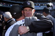 DENVER - OCTOBER 01:  Manager Jim Tracy (R) and closer Huston Street (L) of the Colorado Rockies celebrate after they defeated the Milwaukee Brewers at Coors Field on October 1, 2009 in Denver, Colorado. The Rockies defeated the Brewers 9-2 and clinched a National League playoff berth.  (Photo by Doug Pensinger/Getty Images)
