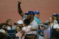 LOS ANGELES - JUNE 20: Kobe Bryant #8 of the Los Angeles Lakers holds his daughter while attending the interleague game between the New York Yankees and the Los Angeles Dodgers at Dodger Stadium on June 20, 2004 in Los Angeles, California. The Dodgers won 5-4. (Photo by Streeter Lecka/Getty Images)