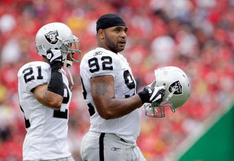 KANSAS CITY, MO - SEPTEMBER 20:  Defensive end Richard Seymour #92 of the Oakland Raiders walks onto the field with Nnamdi Asomugha #21 during the game against the Kansas City Chiefs at Arrowhead Stadium on September 20, 2009 in Kansas City, Missouri.  (Photo by Jamie Squire/Getty Images)
