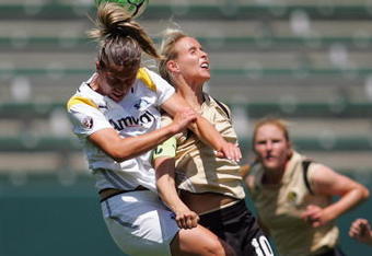 CARSON, CA - APRIL 19:  Camille Abily #20 of the Los Angeles Sol goes up for the header against Leslie Osborne #10 of FC Gold Pride during the WPS match at The Home Depot Center on April 19, 2009 in Carson, California. (Photo by Victor Decolongon/Getty Images)