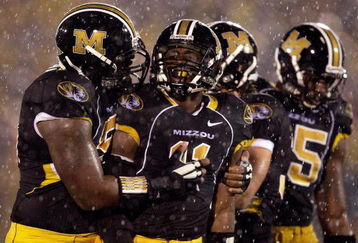 COLUMBIA, MO - OCTOBER 08:  Jarell Harrison #11 of the Missouri Tigers is congratulated by teammates after making a play during the game against the Nebraska Cornhuskers on October 8, 2009 at Faurot Field/Memorial Stadium in Columbia, Missouri.  (Photo by Jamie Squire/Getty Images)