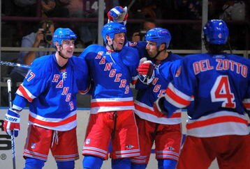 NEW YORK - OCTOBER 3: Brandon Dubinsky #17 of the New York Rangers is congratulated by Vinny Prospal #20, Michal Rozsival #33, and Michael Del Zotto #4, after scoring a second period goal against the Ottawa Senators at Madison Square Garden on October 3, 2009 in New York City. (Photo by Christopher Pasatieri/Getty Images)