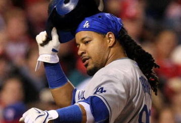 PHILADELPHIA - OCTOBER 19:  Manny Ramirez #99 of the Los Angeles Dodgers reacts after he scored on a RBI single by Casey Blake #23 in the top of the sixth inning against of the Philadelphia Phillies in Game Four of the NLCS during the 2009 MLB Playoffs at Citizens Bank Park on October 19, 2009 in Philadelphia, Pennsylvania.  (Photo by Nick Laham/Getty Images)