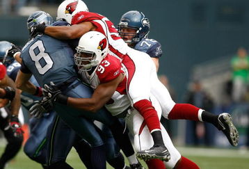 SEATTLE, WA - OCTOBER 18:  Quarterback Matt Hasselbeck #8 of the Seattle Seahawks is sacked by Calais Campbell #93 of the Arizona Cardinals at Qwest Field on October 18, 2009 in Seattle, Washington.  (Photo by Jonathan Ferrey/Getty Images)