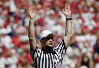 ATHENS, GA - SEPTEMBER 29: NCAA referee Marc Curles signals a score as the Georgia Bulldogs host the Mississippi Rebels at Sanford Stadium on September 29, 2007 in Athens, Georgia.  Georgia won 45 - 17. (Photo by Al Messerschmidt/Getty Images)