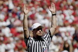 ATHENS, GA - SEPTEMBER 29: NCAA referee Marc Curles signals a score as the Georgia Bulldogs host the Mississippi Rebels at Sanford Stadium on September 29, 2007 in Athens, Georgia.  Georgia won 45 - 17. (Photo by Al Messerschmidt/Getty Images)