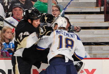 PITTSBURGH - OCTOBER 20: Jay McClement #18 of the St. Louis Blues checks Jay McKee #74 of the Pittsburgh Penguins on October 20, 2009 at Mellon Arena in Pittsburgh, Pennsylvania.  (Photo by Jamie Sabau/Getty Images)
